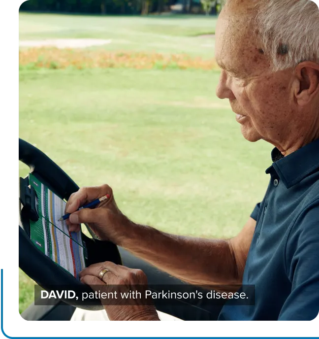 David, a patient with Parkinson’s disease, filling out a scorecard